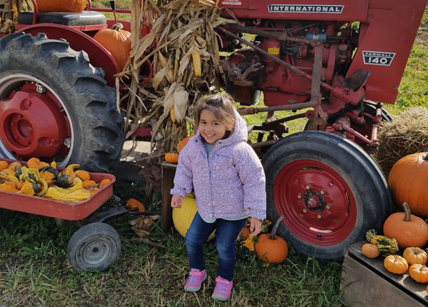 Young Girl At Greg's U-Pick Pumpkin Patch